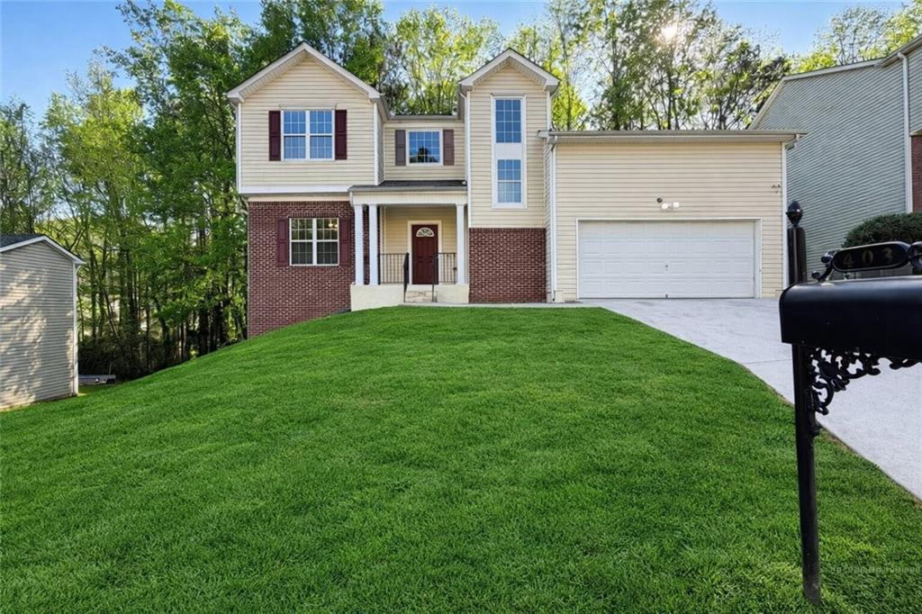 403 Clearstream Lane Austell, GA 30168 - Photo 1 of 25 a front view of a house with a yard and trees