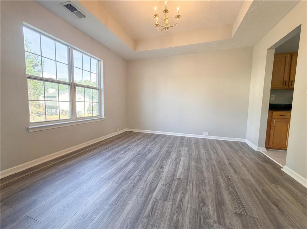 403 Clearstream Lane Austell, GA 30168 - Photo 13 of 25 a view of an empty room with wooden floor and a window
