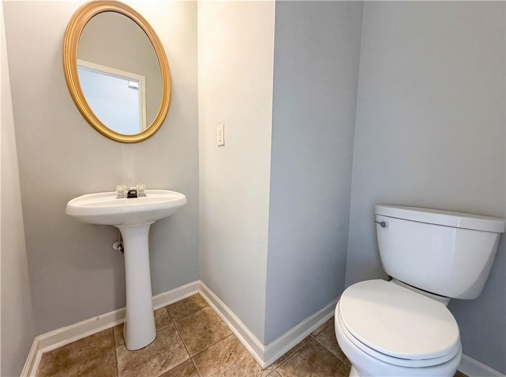 403 Clearstream Lane Austell, GA 30168 - Photo 17 of 25 a bathroom with a toilet sink and mirror