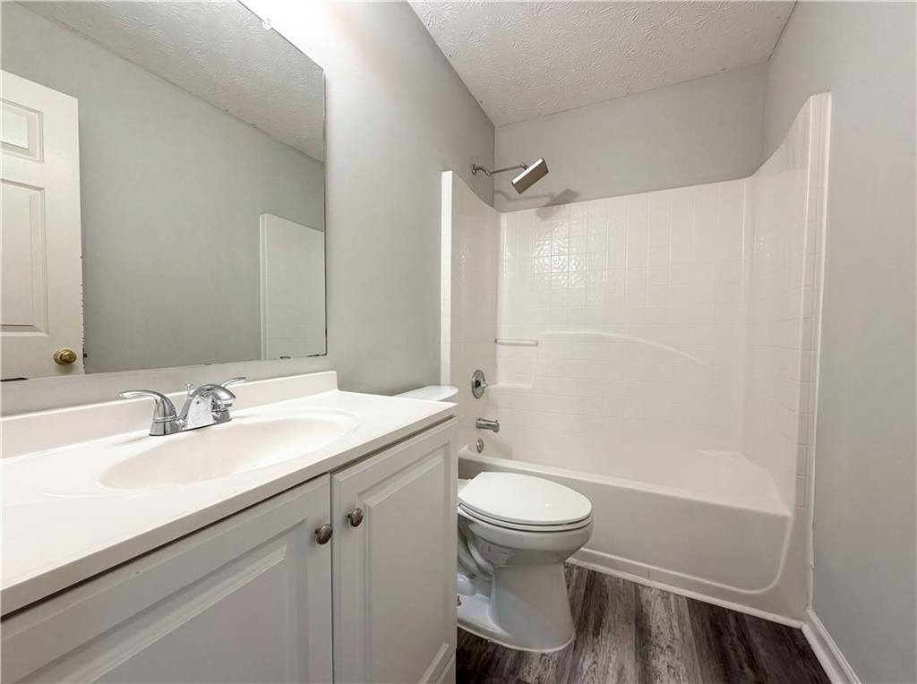 403 Clearstream Lane Austell, GA 30168 - Photo 21 of 25 a bathroom with a sink toilet and shower