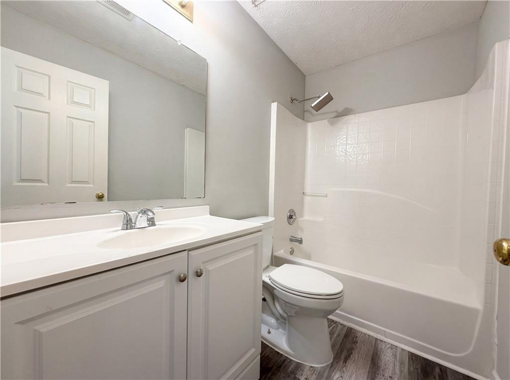 403 Clearstream Lane Austell, GA 30168 - Photo 22 of 25 a bathroom with a sink toilet a mirror and shower