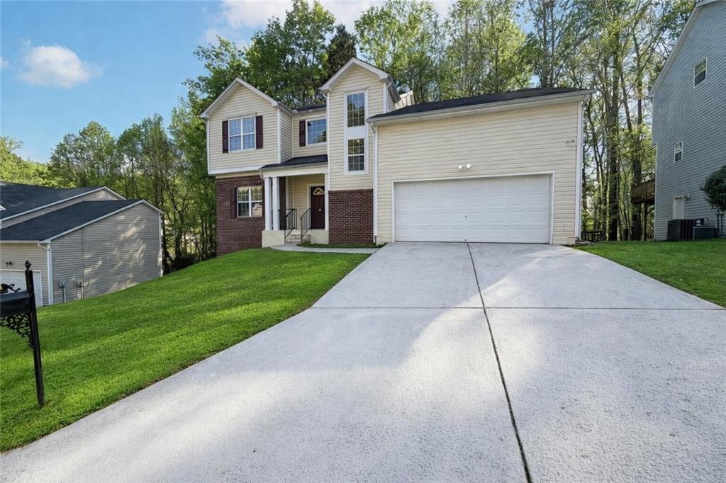 403 Clearstream Lane Austell, GA 30168 - Photo 6 of 25 a front view of a house with a yard and garage