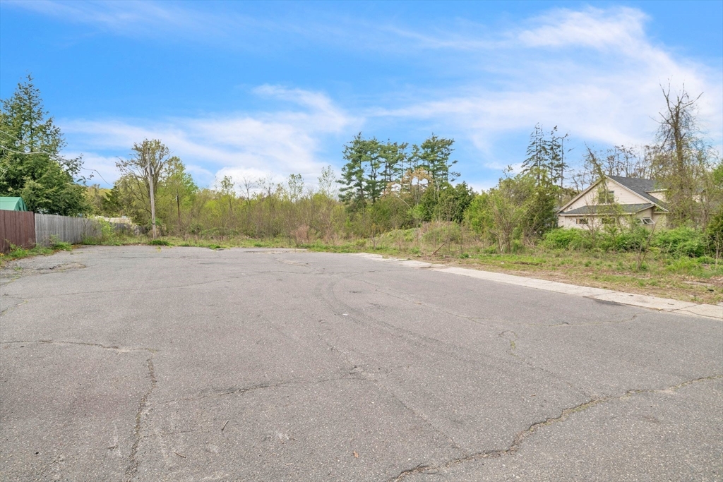 Lot 0 Thorndike And Lawrence Street Palmer, MA 01069 - Photo 6 of 22 a view of dirt field with large trees