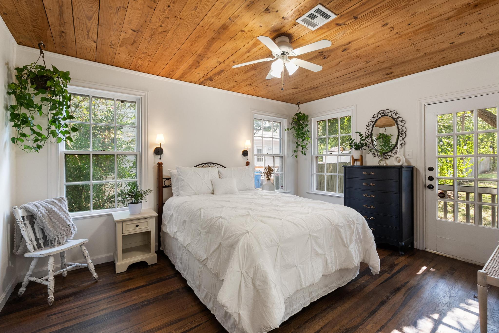 1707 Lexington Street Taylor, TX 76574 - Photo 7 of 29 Bedroom featuring wooden ceiling, dark wood finished floors, access to exterior, a ceiling fan, and ornamental molding