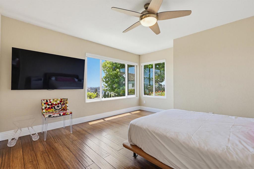 2756 Southampton Road Carlsbad, CA 92010 - Photo 38 of 40 a bedroom with a large bed and a flat tv screen on dresser