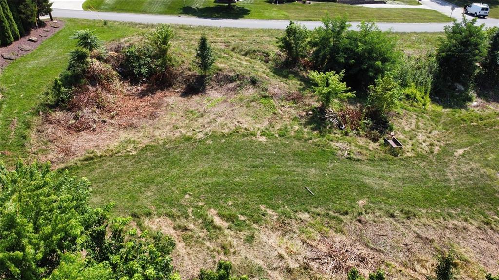 Lot 6 Windcrest Drive Cecil, PA 15321 - Photo 4 of 8 a view of a yard with plants and a wooden bench