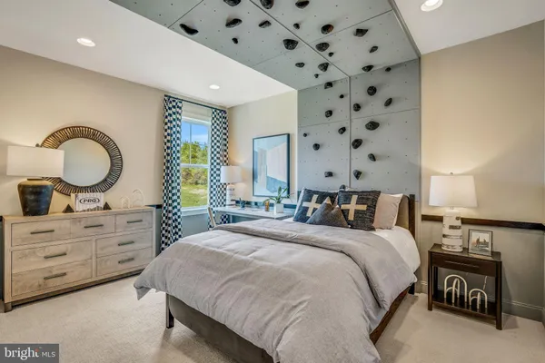 a spacious bathroom with a double vanity sink a large mirror and a bathtub
