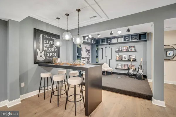 a view of a living room and kitchen