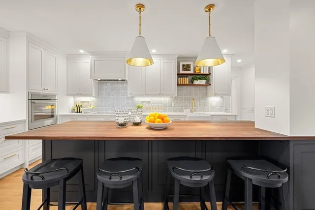 a kitchen with a sink cabinets and window