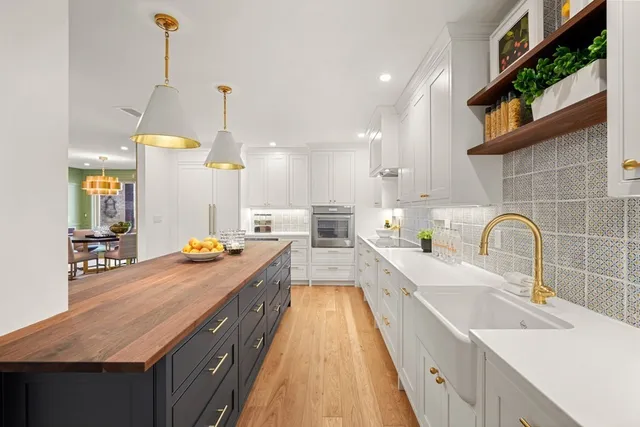 a kitchen with sink and view