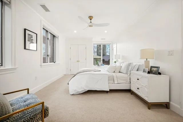 a bed room with a bed and a chandelier