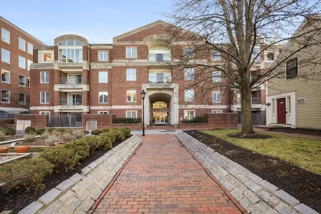 a front view of a residential houses with yard