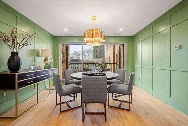 a view of a dining room with furniture window and wooden floor