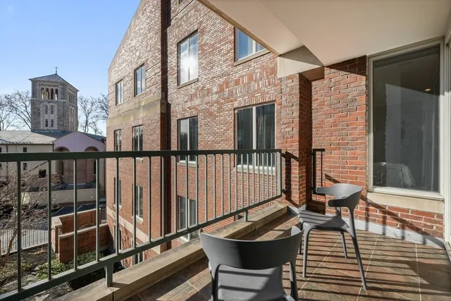 a view of a balcony with chairs