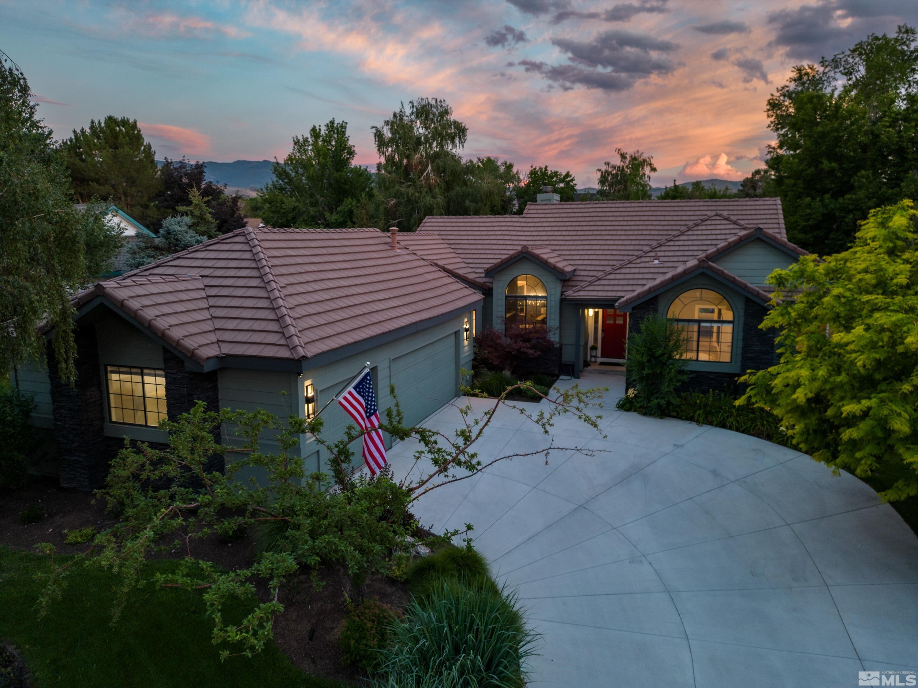 14195 Riata Circle Reno, NV 89521 - Photo 1 of 29 a aerial view of a house with a yard and a garden