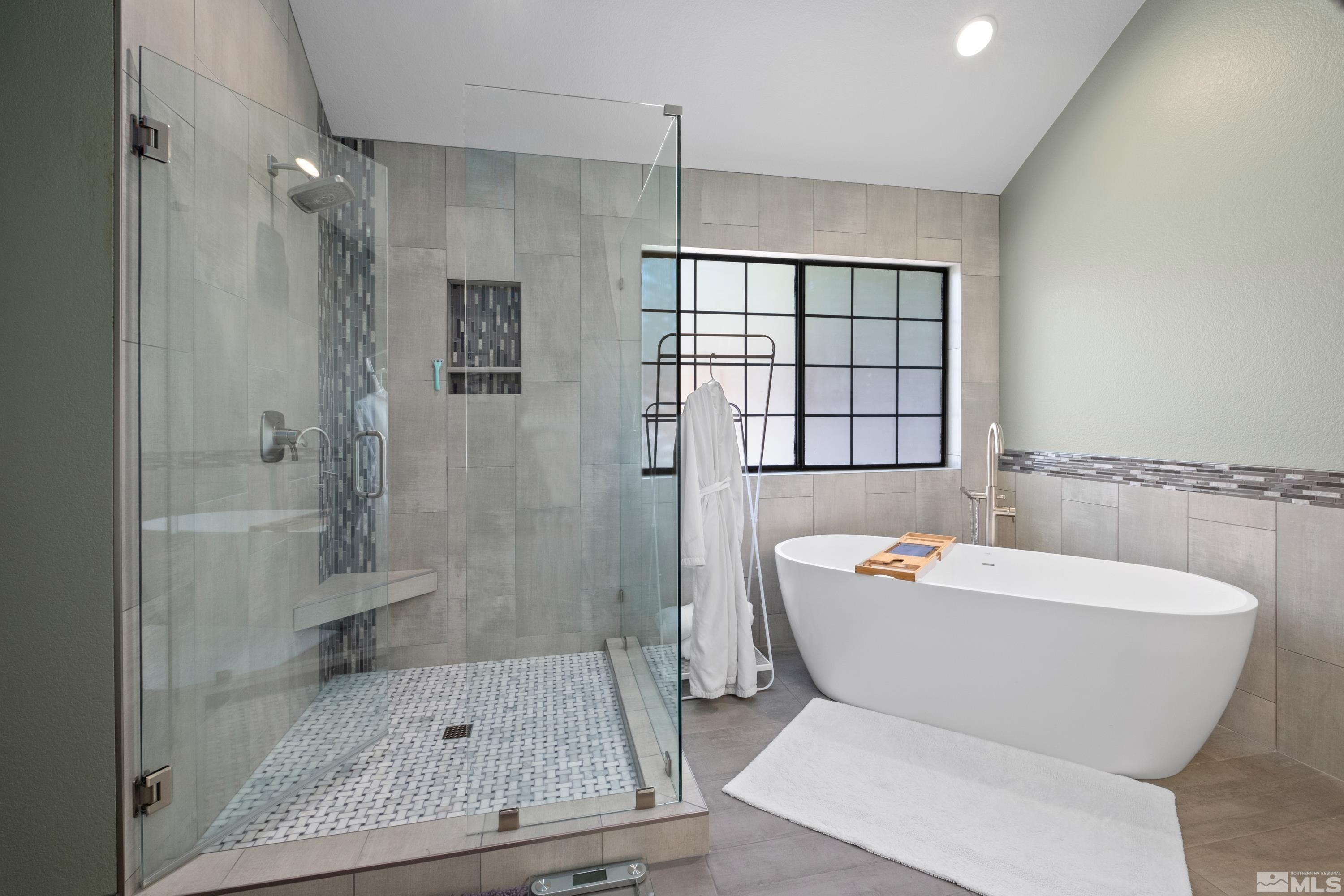 14195 Riata Circle Reno, NV 89521 - Photo 13 of 29 a bathroom with a bathtub and a shower