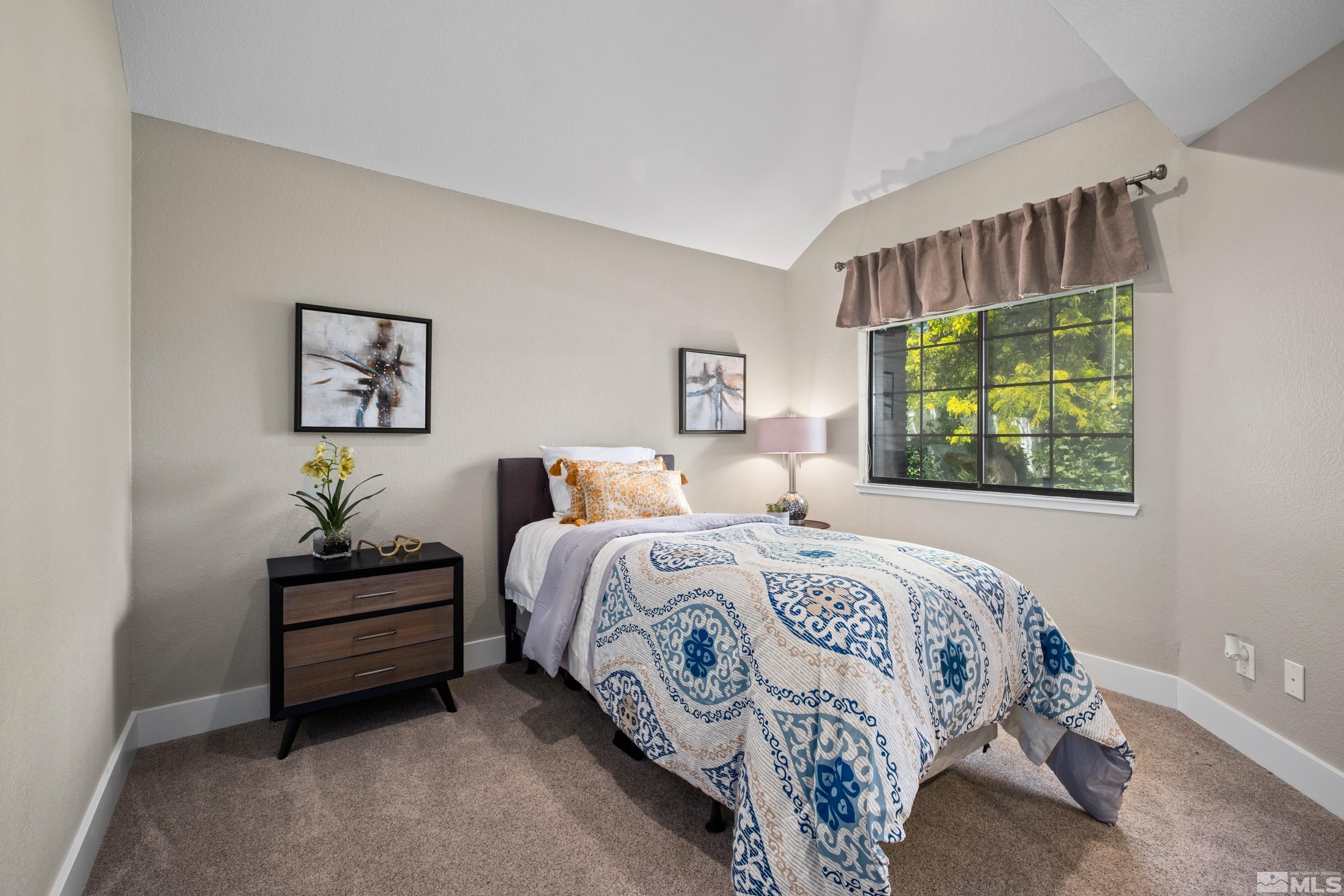 14195 Riata Circle Reno, NV 89521 - Photo 15 of 29 a bedroom with a bed and a window
