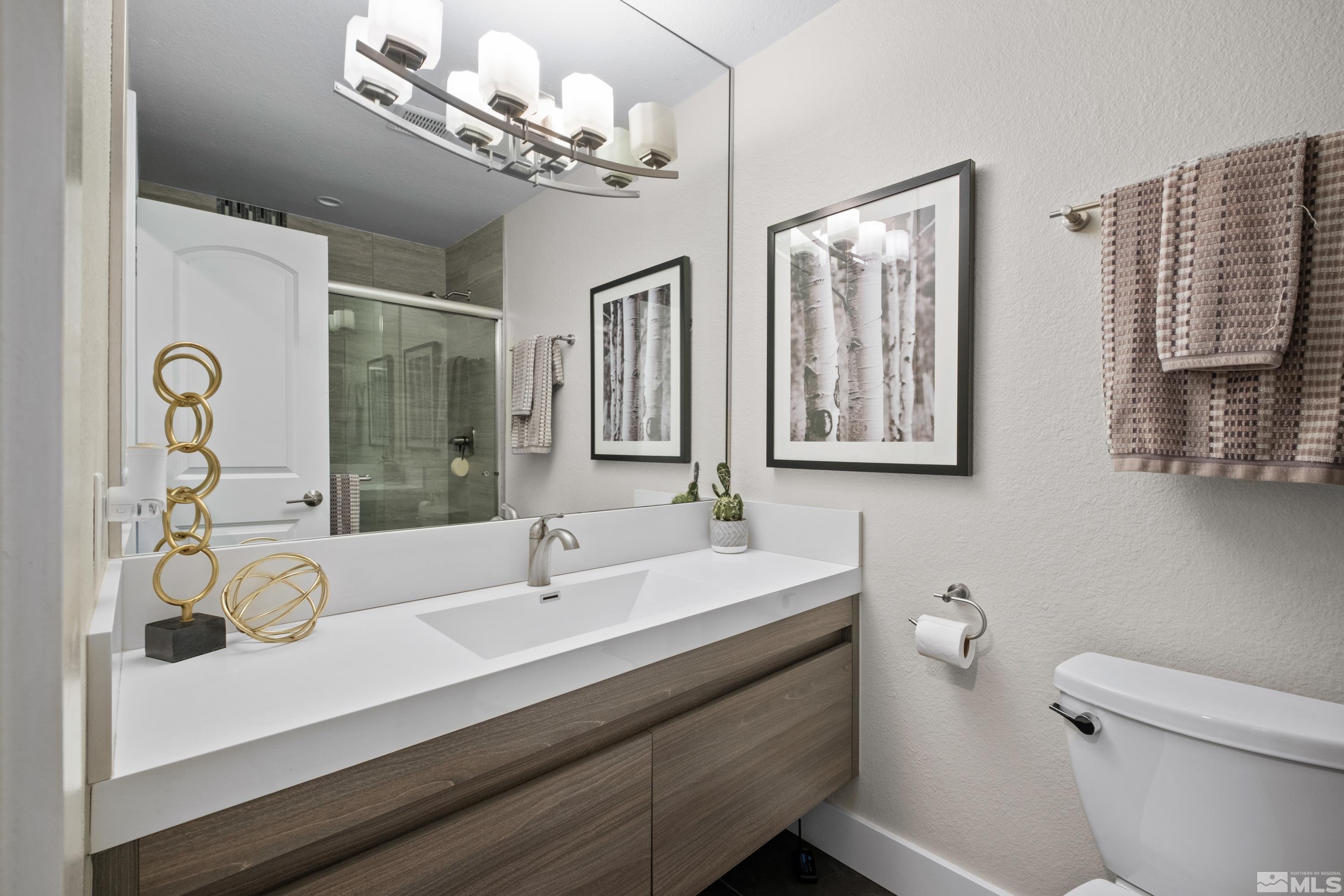 14195 Riata Circle Reno, NV 89521 - Photo 16 of 29 a bathroom with a sink double vanity and a mirror