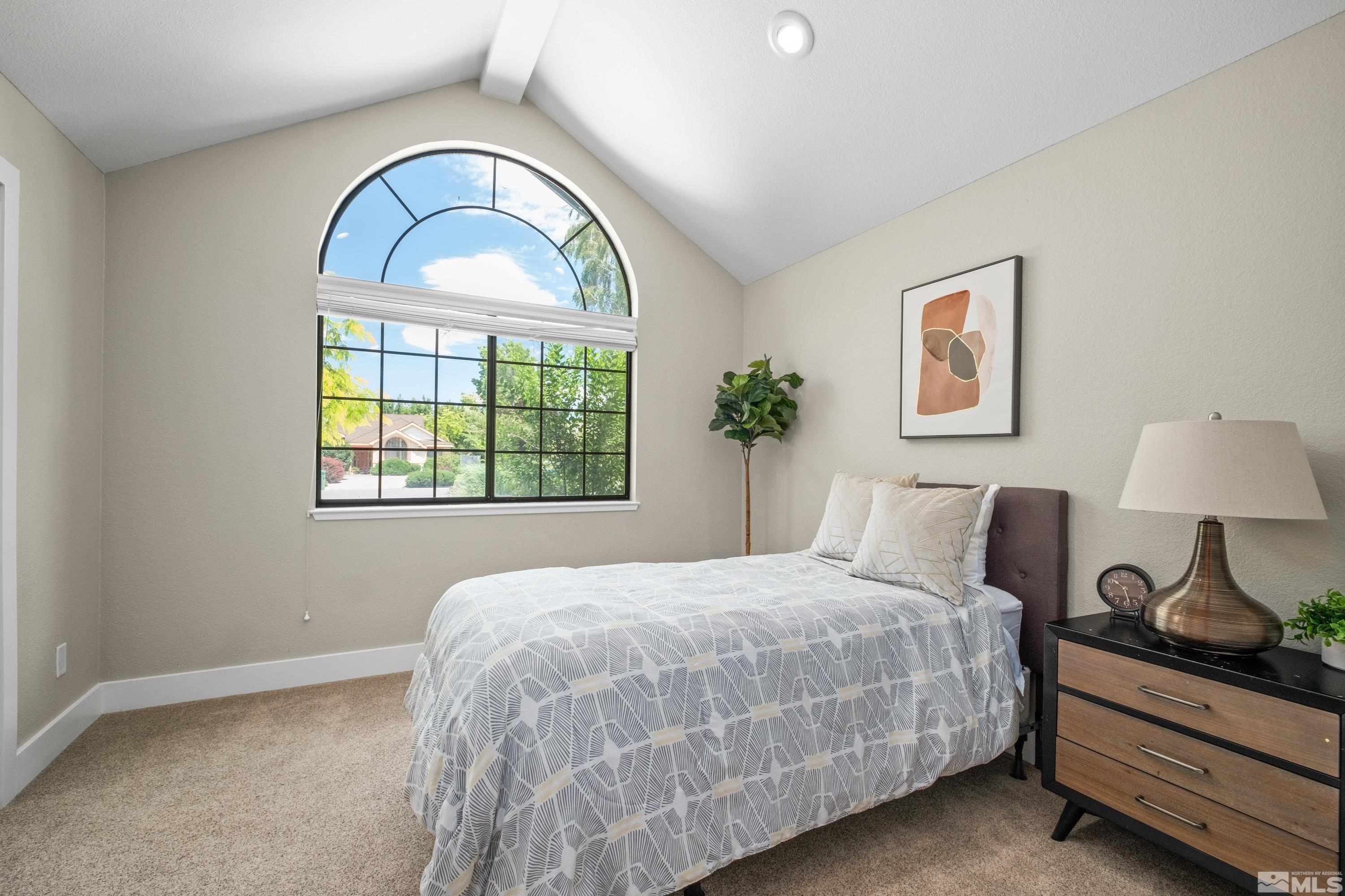 14195 Riata Circle Reno, NV 89521 - Photo 17 of 29 a bedroom with a bed and a window
