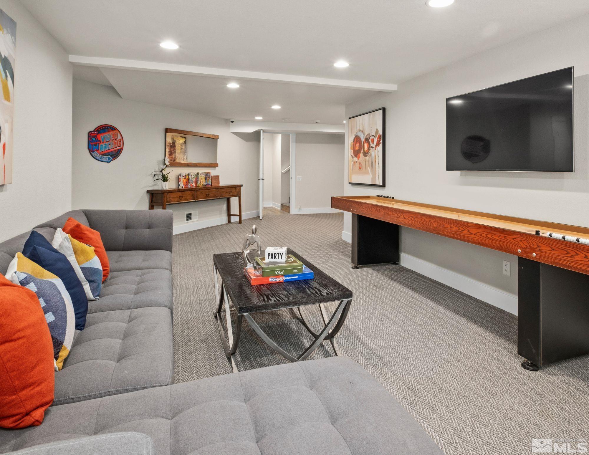 14195 Riata Circle Reno, NV 89521 - Photo 20 of 29 a living room with furniture and a flat screen tv