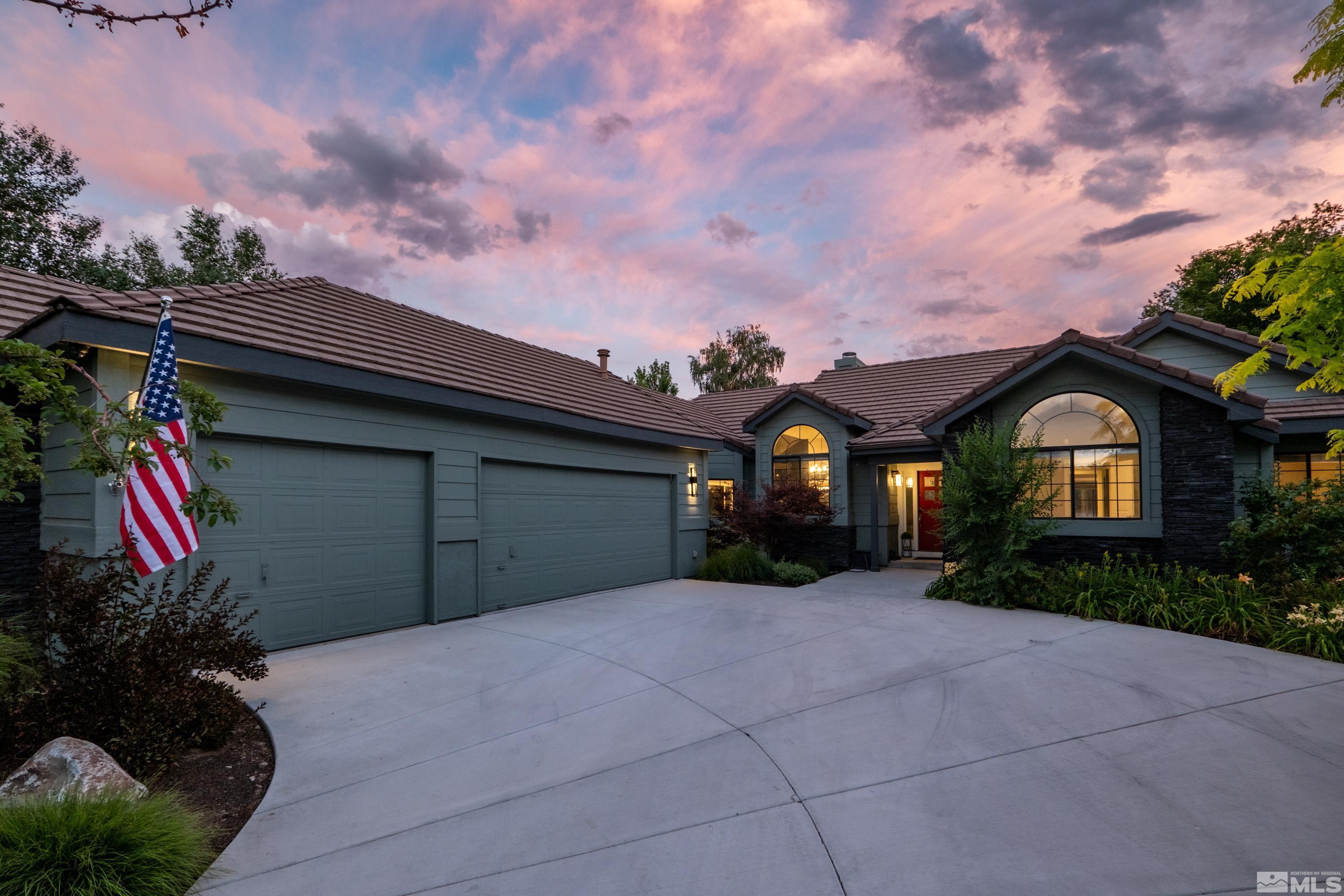 14195 Riata Circle Reno, NV 89521 - Photo 2 of 29 a front view of a house with garden