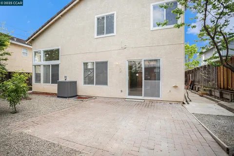 a spacious bathroom with a double vanity sink and a mirror