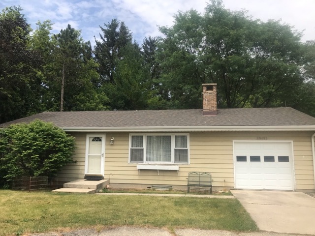 9-n087 Corron Road Elgin, IL 60124 - Photo 1 of 12 a front view of a house with a yard
