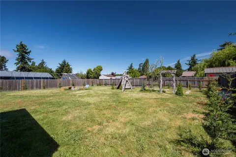 a swimming pool with wooden fence