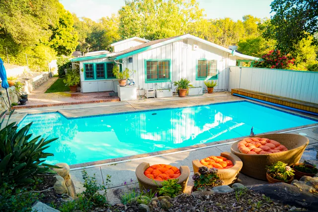 a view of a swimming pool with a patio