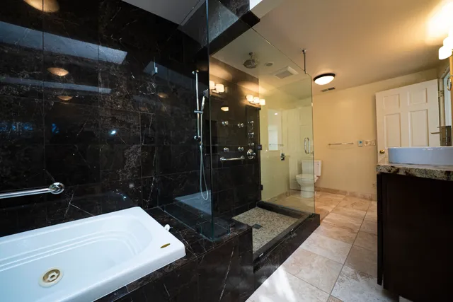 a bathroom with a sink a shower and a mirror