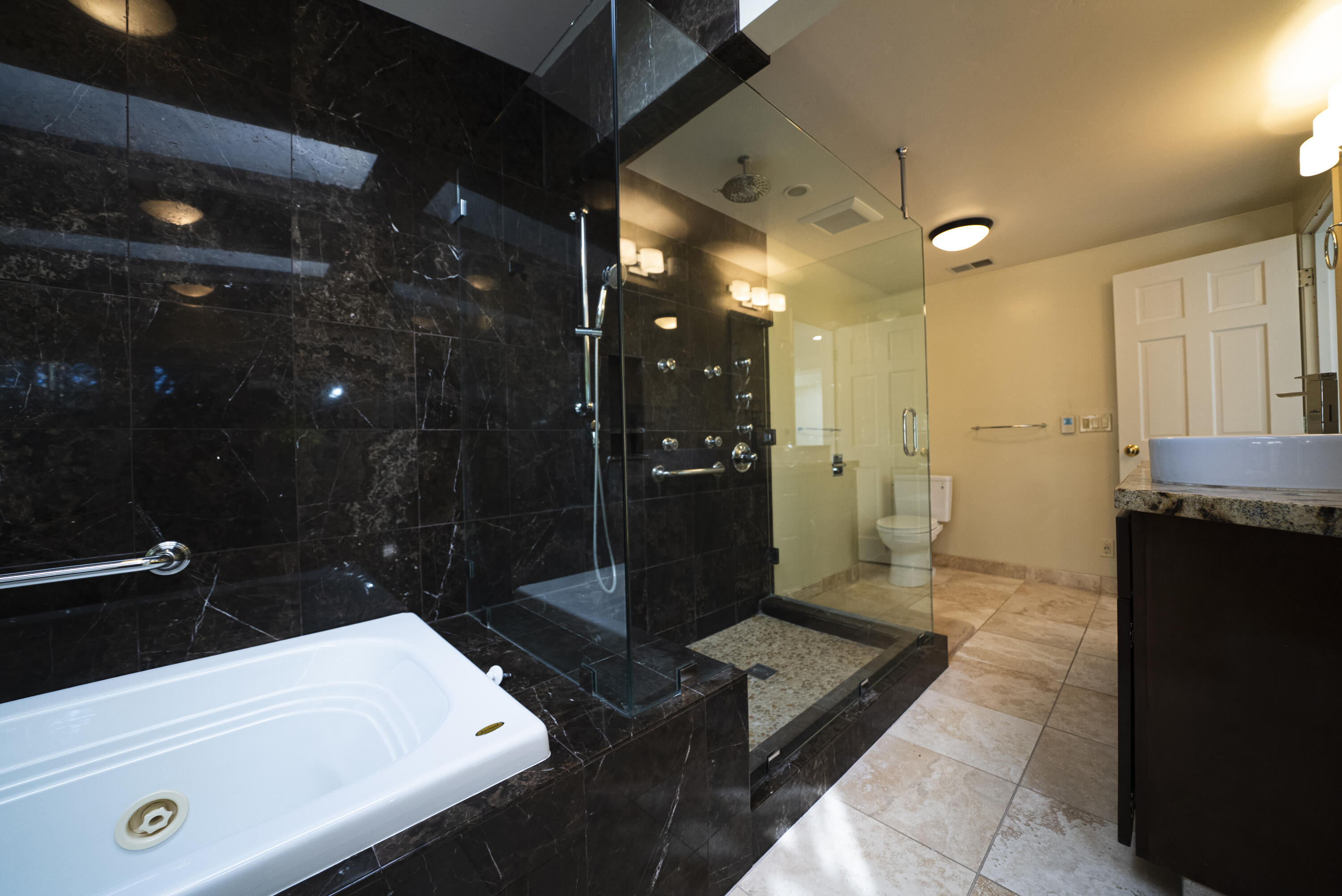 704 Ladera Lane Santa Barbara, CA 93108 - Photo 14 of 20 a bathroom with a sink a shower and a mirror