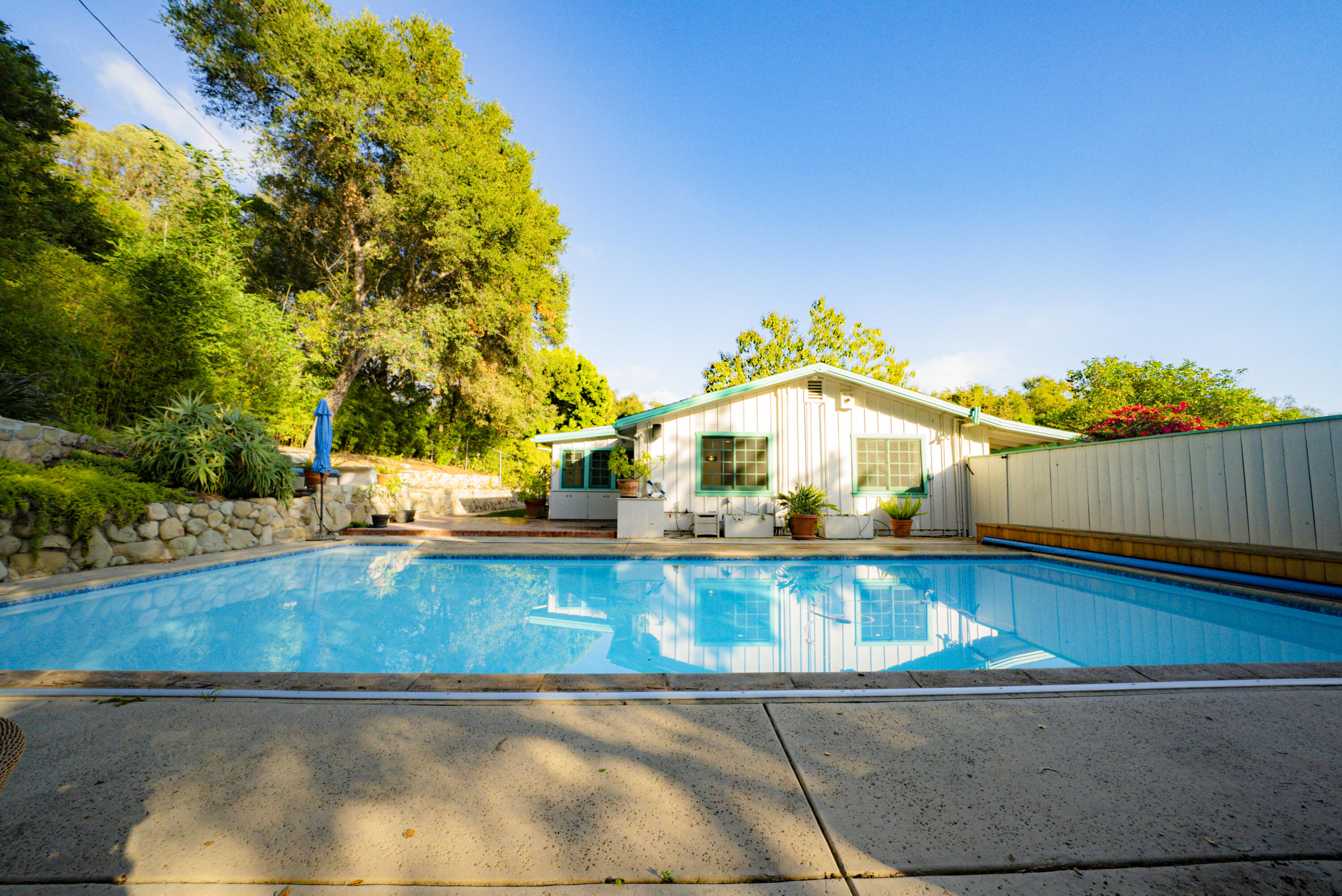 704 Ladera Lane Santa Barbara, CA 93108 - Photo 20 of 20 a view of a swimming pool with an outdoor space and seating area