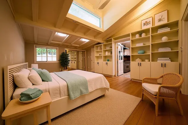 a bedroom with a bed and a chair