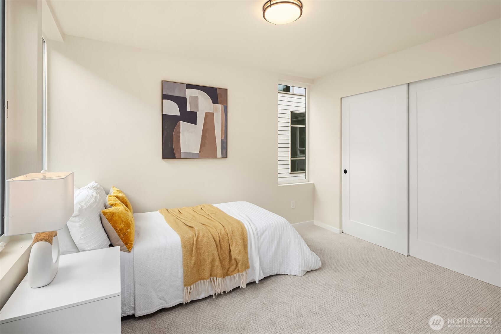 1514 Northwest 63rd Street, Unit B Seattle, WA 98107 - Photo 12 of 20 a bedroom with a bed and a couch