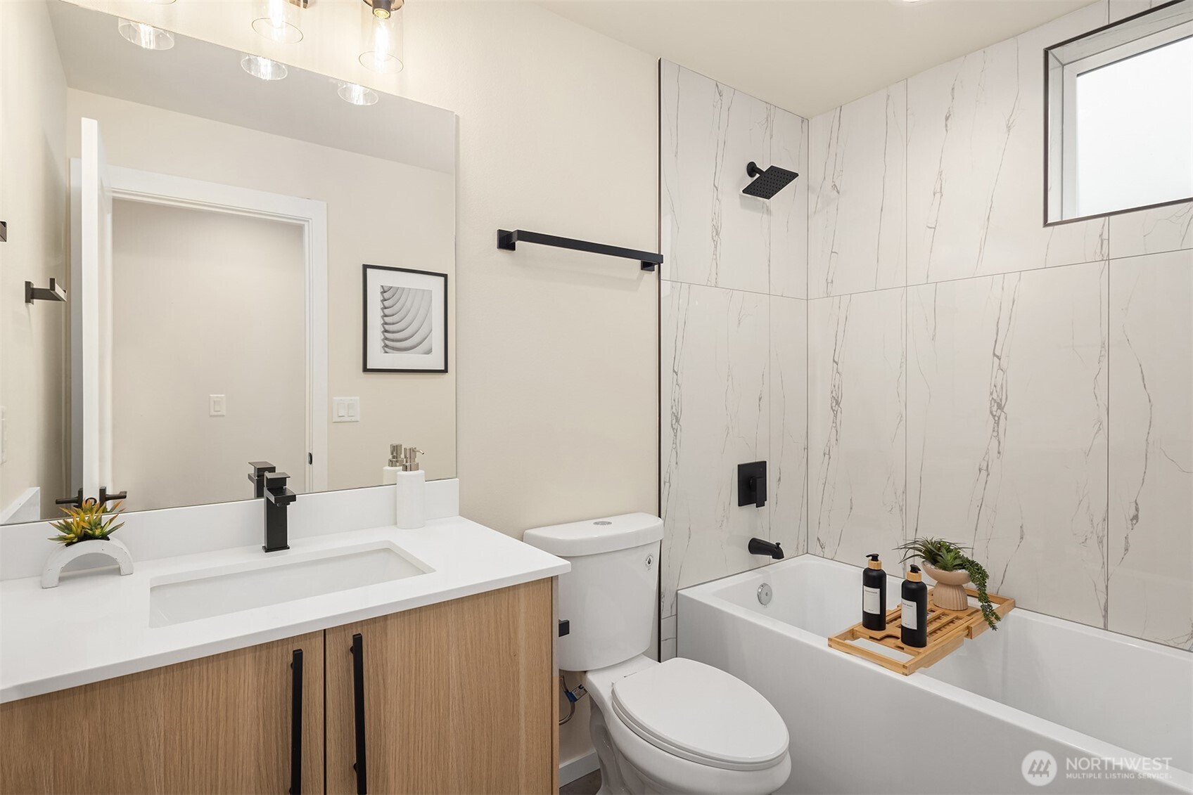 1514 Northwest 63rd Street, Unit B Seattle, WA 98107 - Photo 13 of 20 a bathroom with a sink a toilet and shower