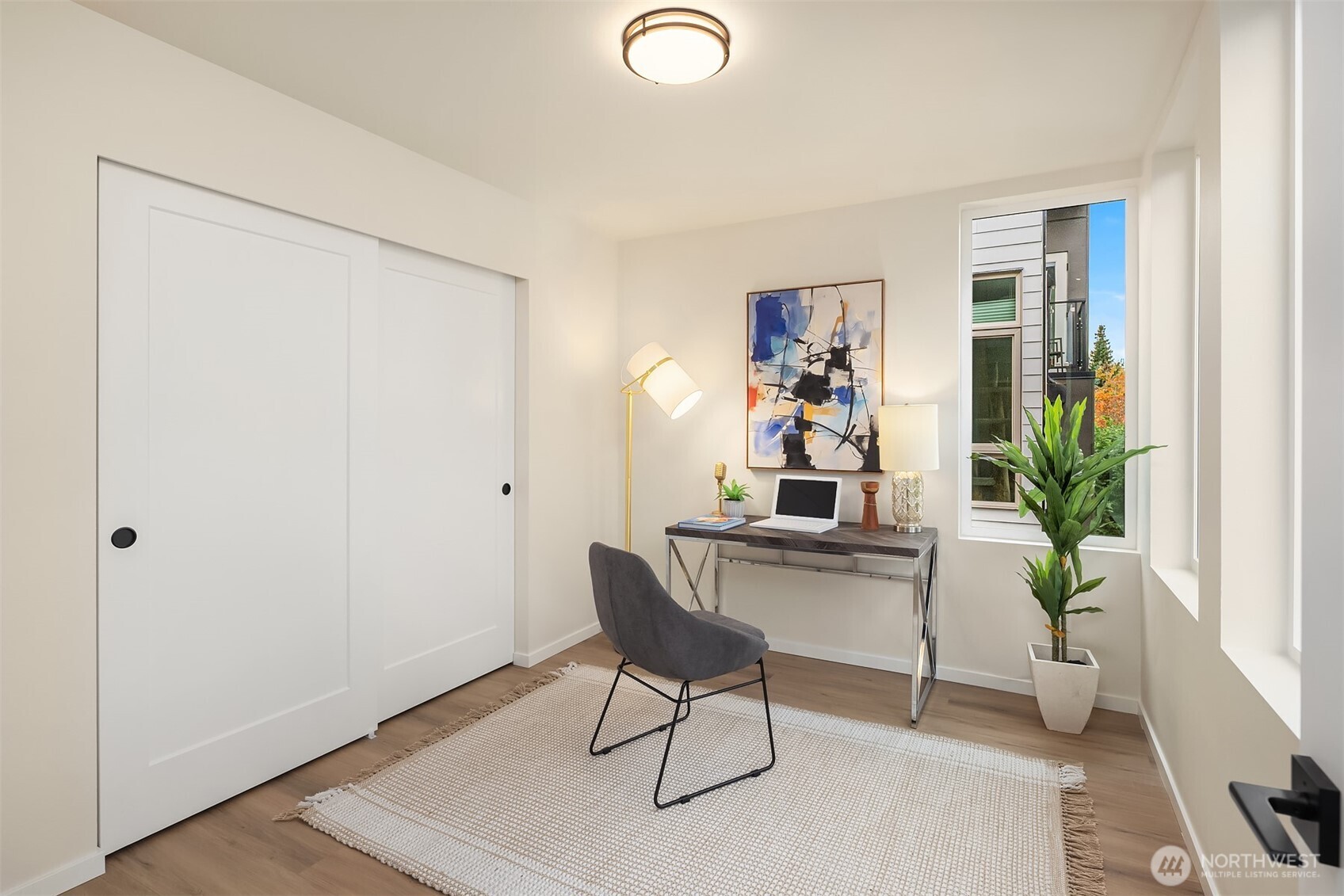 1514 Northwest 63rd Street, Unit B Seattle, WA 98107 - Photo 14 of 20 a view of a workspace with furniture and a potted plant