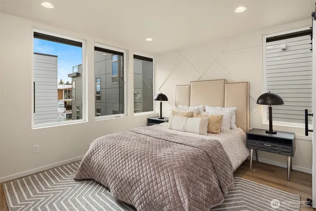 a bedroom with a bed and a lamp