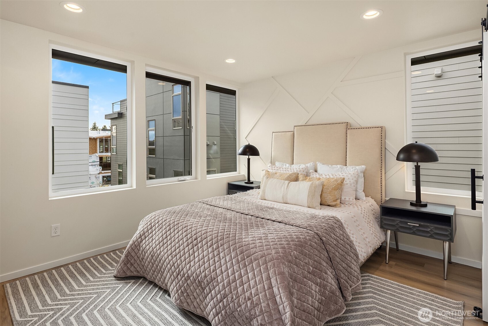 1514 Northwest 63rd Street, Unit B Seattle, WA 98107 - Photo 15 of 20 a bedroom with a bed and a lamp