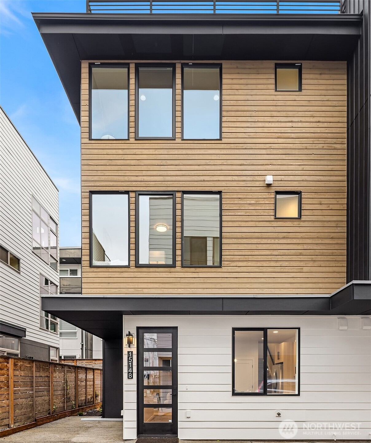 1514 Northwest 63rd Street, Unit B Seattle, WA 98107 - Photo 2 of 20 a building view with a outdoor space