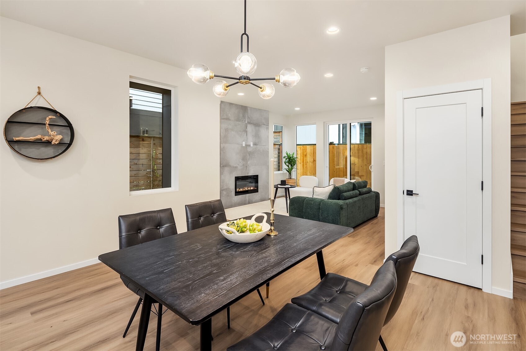 1514 Northwest 63rd Street, Unit B Seattle, WA 98107 - Photo 6 of 20 a view of a dining room with furniture and a chandelier