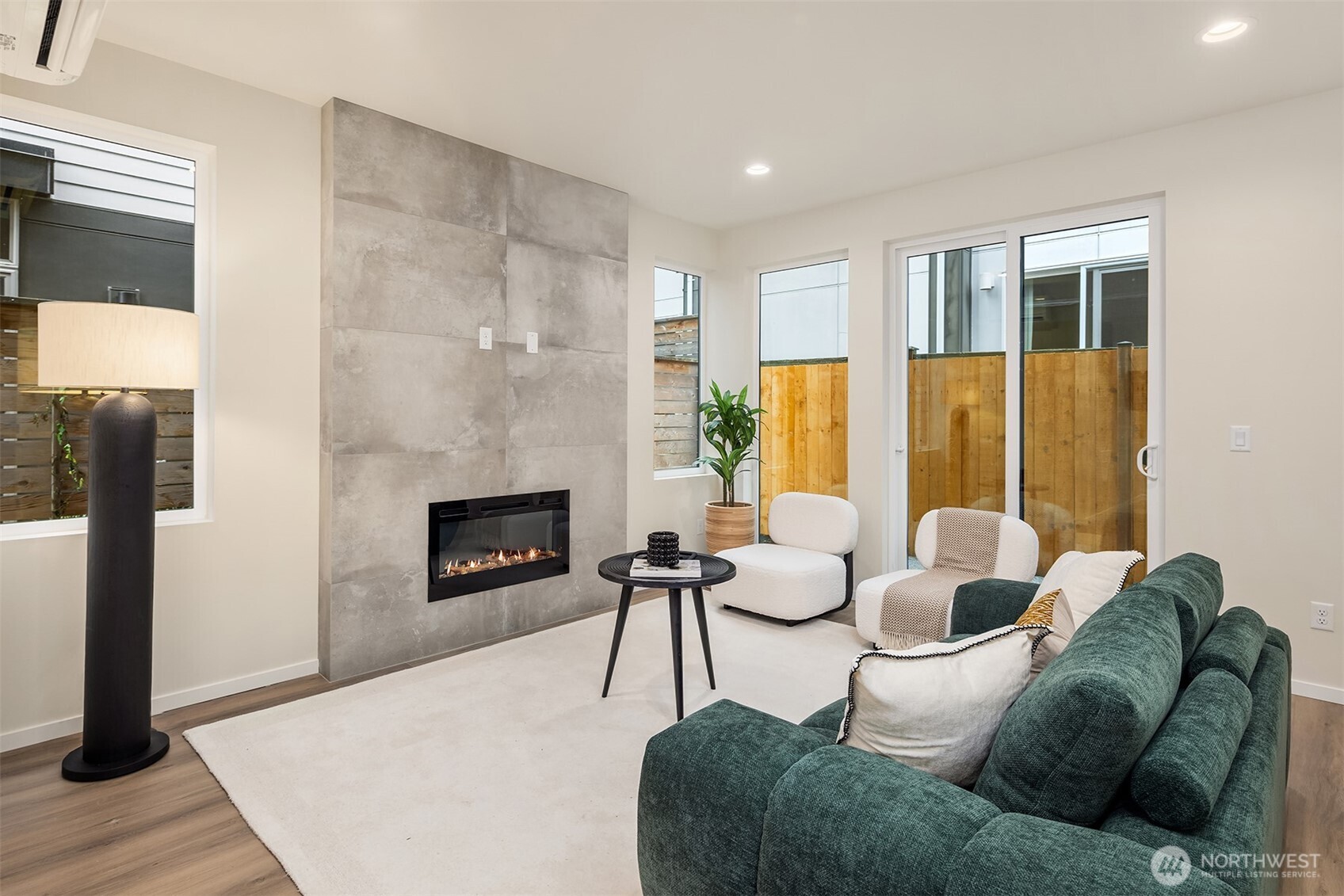 1514 Northwest 63rd Street, Unit B Seattle, WA 98107 - Photo 7 of 20 a living room with furniture and a fireplace