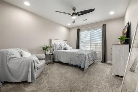 a bedroom with bed and a window