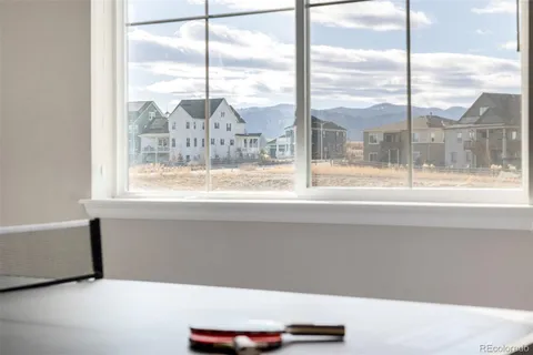 a bedroom with a bed and a potted plant