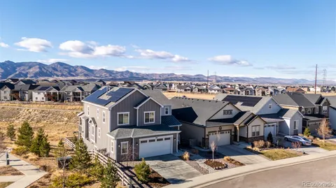 aerial view of a house with a yard