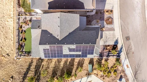 an aerial view of a house with a ocean view