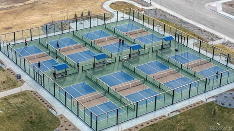 a view of a town with mountains in the background