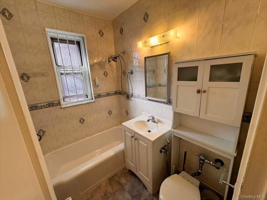 63-60 102nd Street, Unit A7 Queens, NY 11374 - Photo 14 of 15 a bathroom with a sink toilet and shower