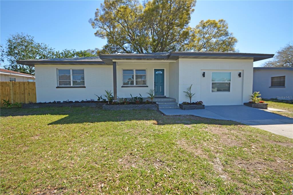 1545 Illinois Road Clearwater, FL 33756 - Photo 1 of 1 a view of a house with backyard and sitting area