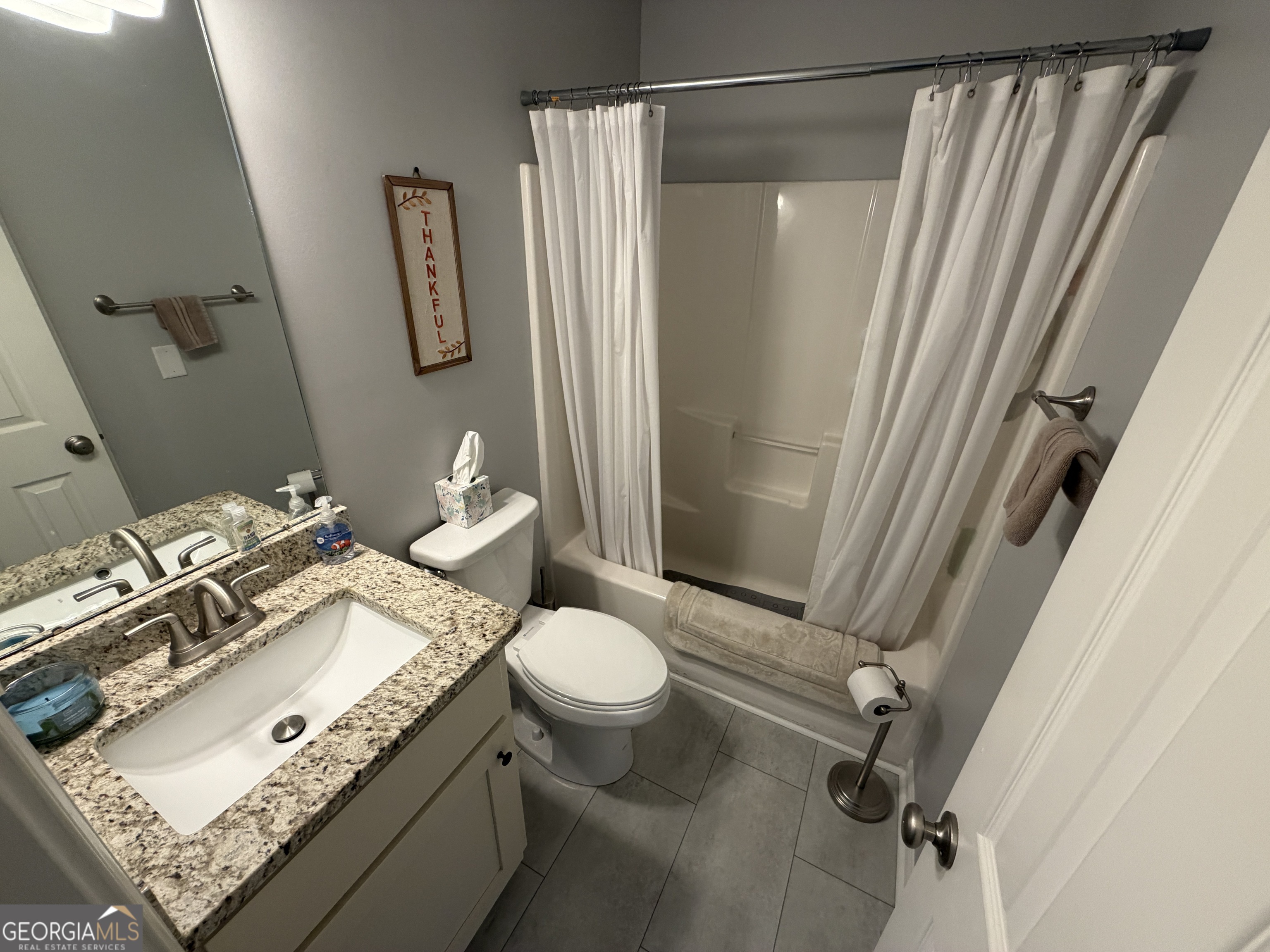 107 Westchester Circle Dublin, GA 31021 - Photo 15 of 22 a bathroom with a granite countertop sink toilet and shower