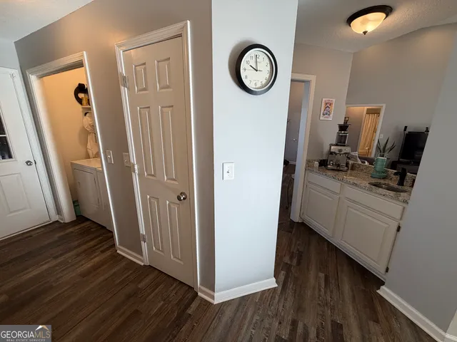 a bedroom with a bed window and dresser